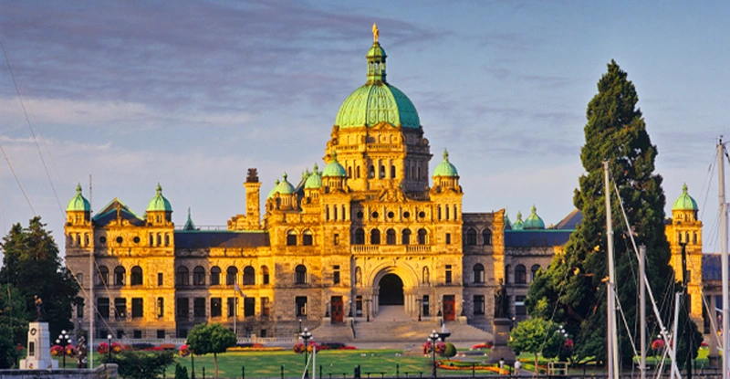 Image of the BC Legislature in Victoria in the setting sun