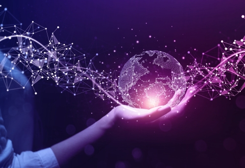 Hand holding the globe