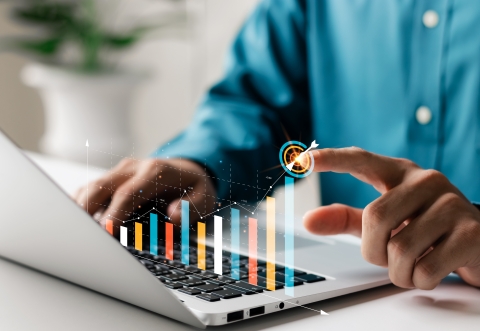 Businessman analyzing company's financial balance sheet working with digital augmented reality graphics